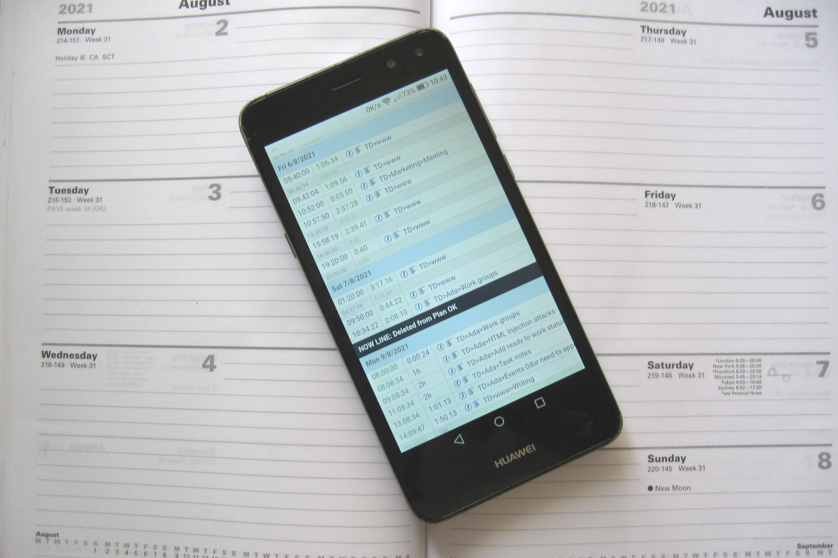 A mobile phone with <i>Time LINE</i> page on the screen